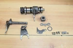 1984-85 Suzuki Shifter Star Gear Drum Forks 25310-14502. Fixed Price $44.00.